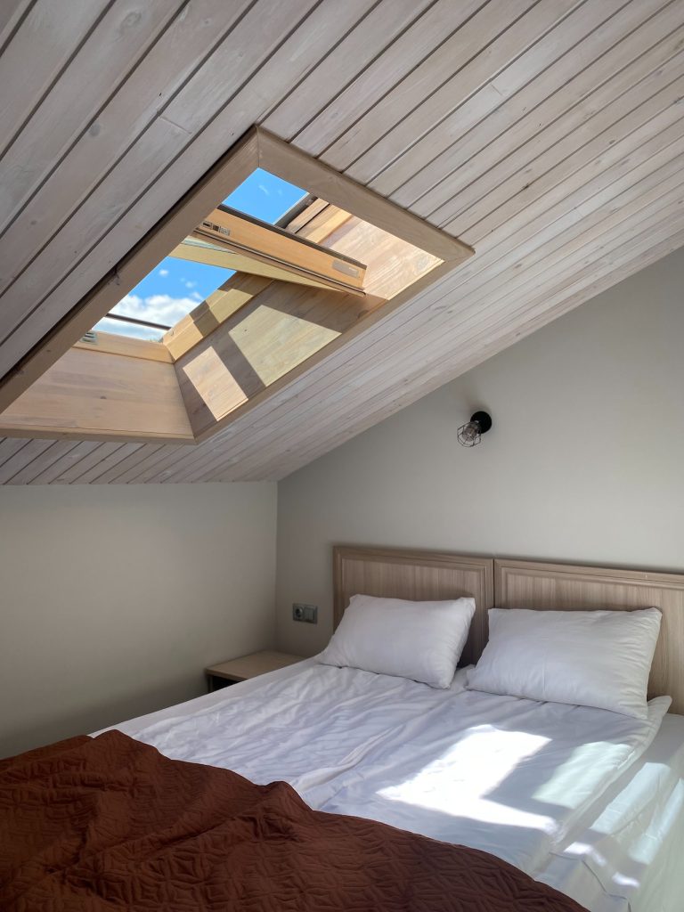 double bed under roof window